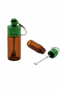 Glass bottle with spoon